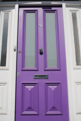 Ome Smart Doorbell on Purple Door