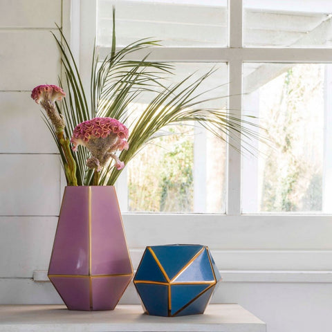 Ome Smart Doorbell loves glass and metal vases in pink and blue