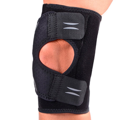 man's knee in knee-cap-stabilizing hinged knee brace