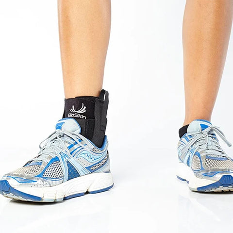 A person comfortably wearing a premium Ankle Compression brace with running shoes 