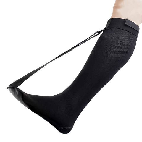 Adult leg and foot, wearing a PediFix FasciaFIX Plantar Fascia Stretching Sock
