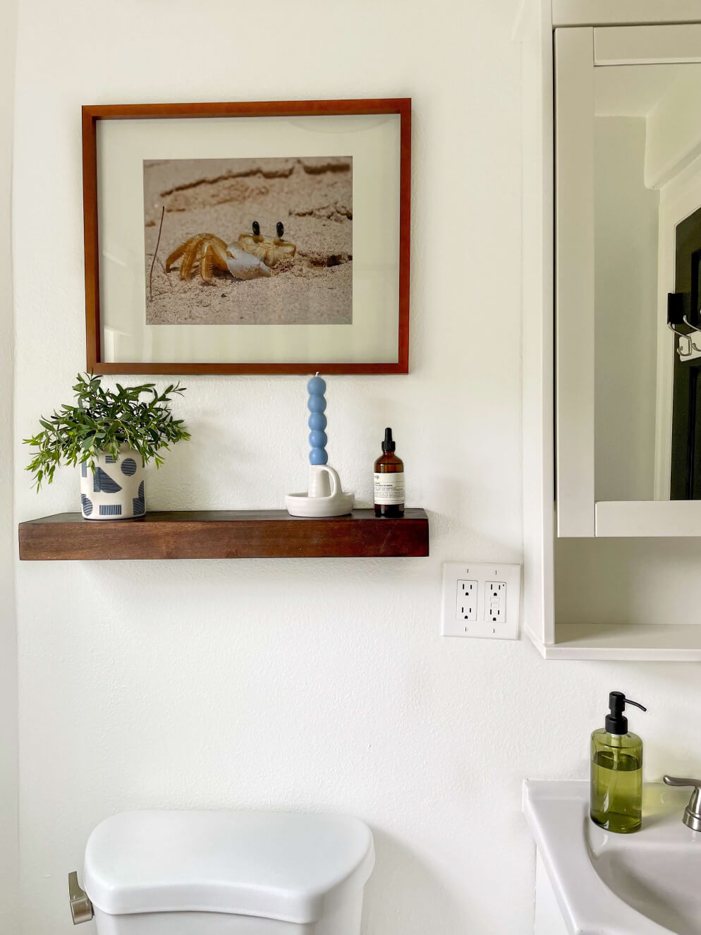 Bathroom with shelf and blue candle