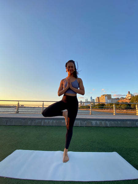 Mikayla outside doing tree pose