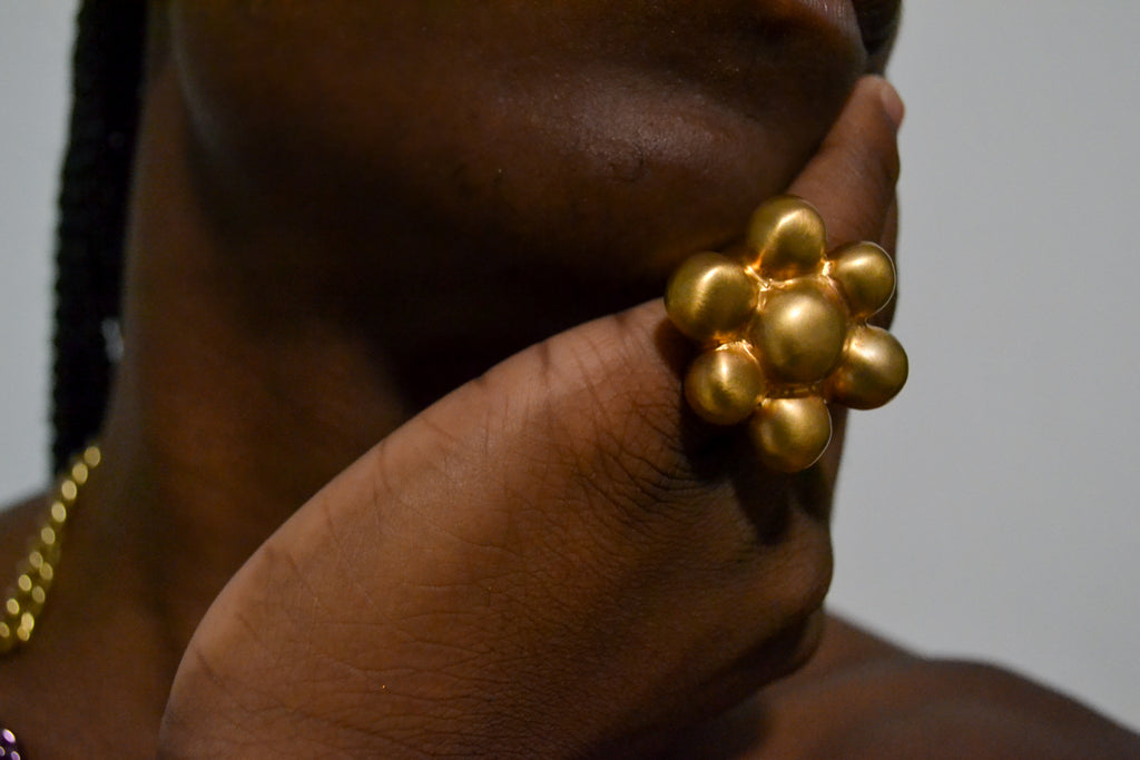 Isaiah in the matte gold Bubble Ring 
