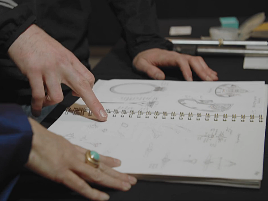 Discussing sketches for a stunning custom engagement ring.