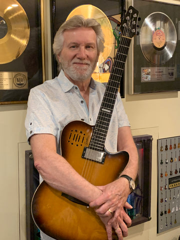 Rik Emmett and his Godin A6