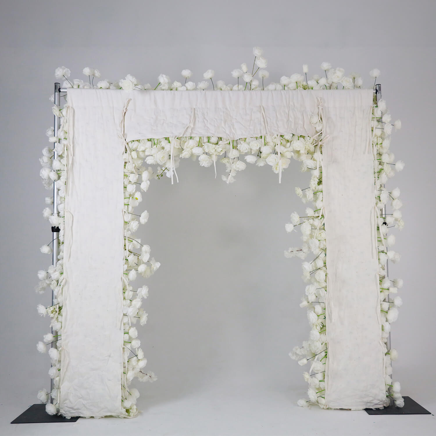 White fabric artificial flower wall is easy to install.