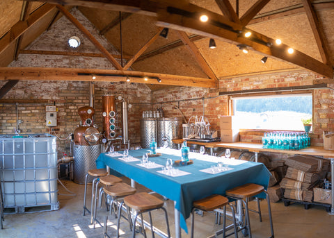 Converted distillery with Roundwood Blue tablecloth and tasting table