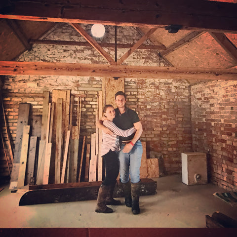 Emily and Rupert standing within distillery building site