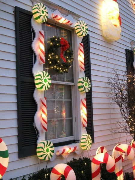 christmas window decorated with candy lights