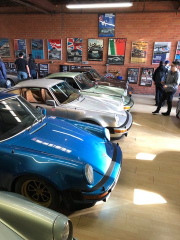 row of magnus walker cars in his garage