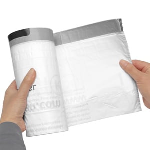 hand pulling liner from roll pack