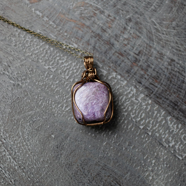 A Charoite Pendant with Solid Lavender Color