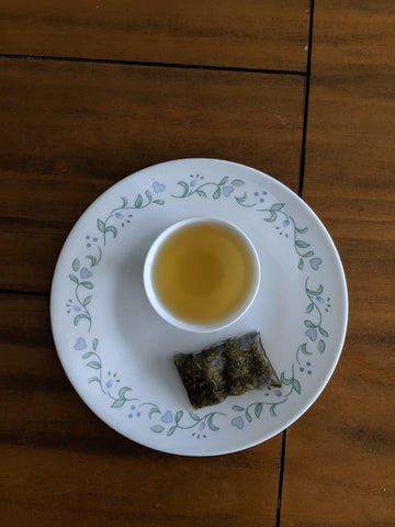 Lakyrsiew green tea, brewed in a cup