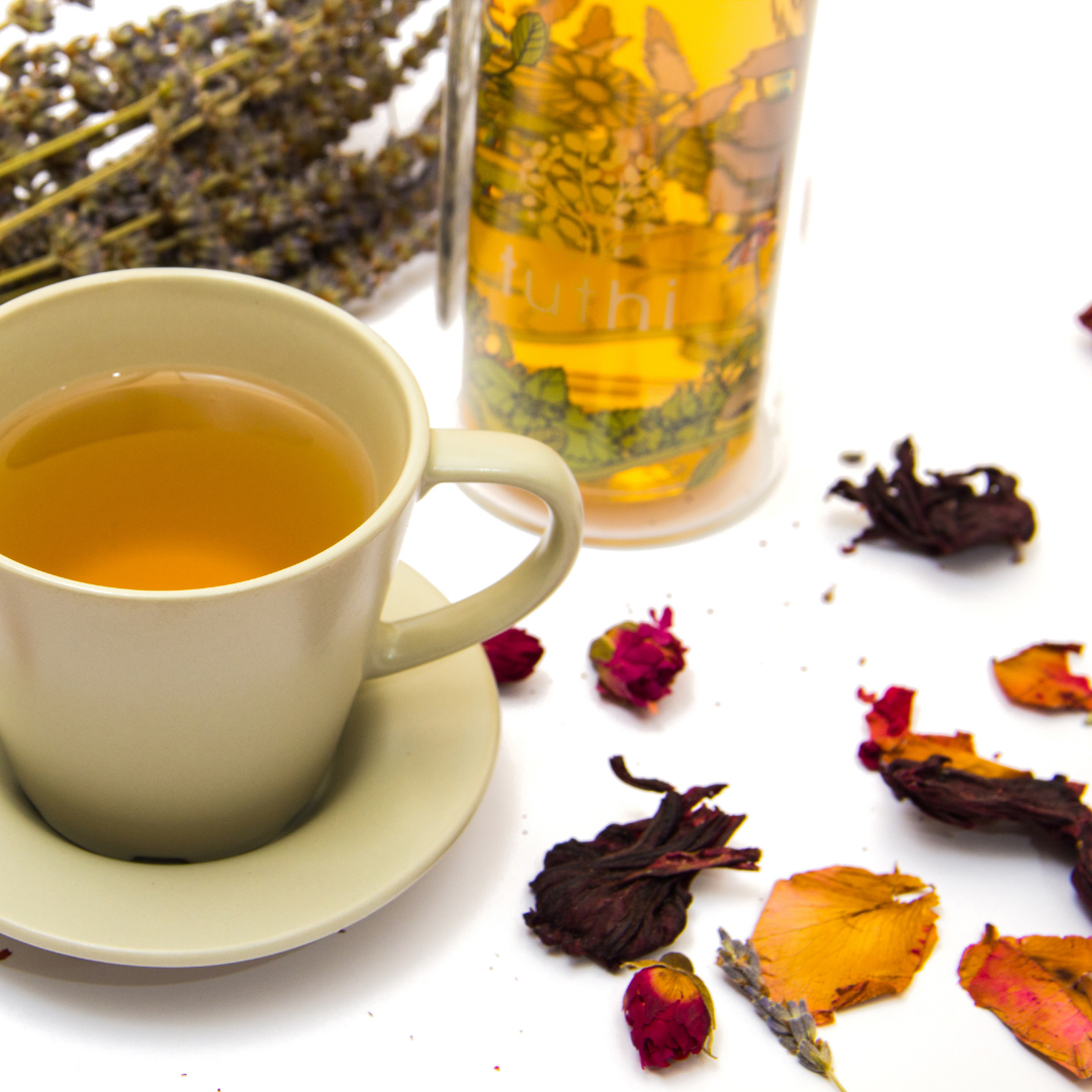 Tea cup with herbs and petals