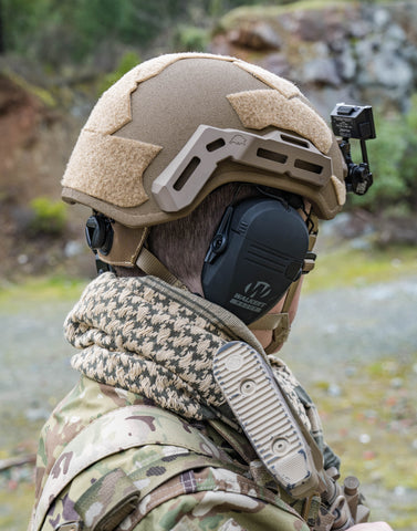Soldier wearing ballistic helmet with accessories