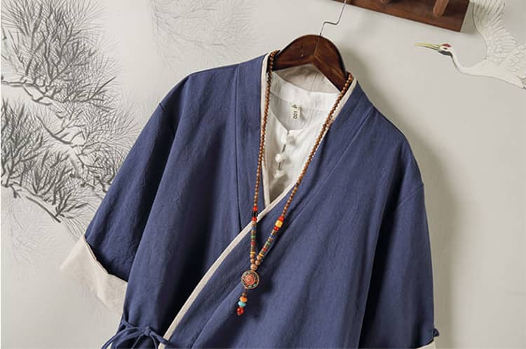 front collar of a navy blue Hanfu jacket with short sleeves and folded cuffs