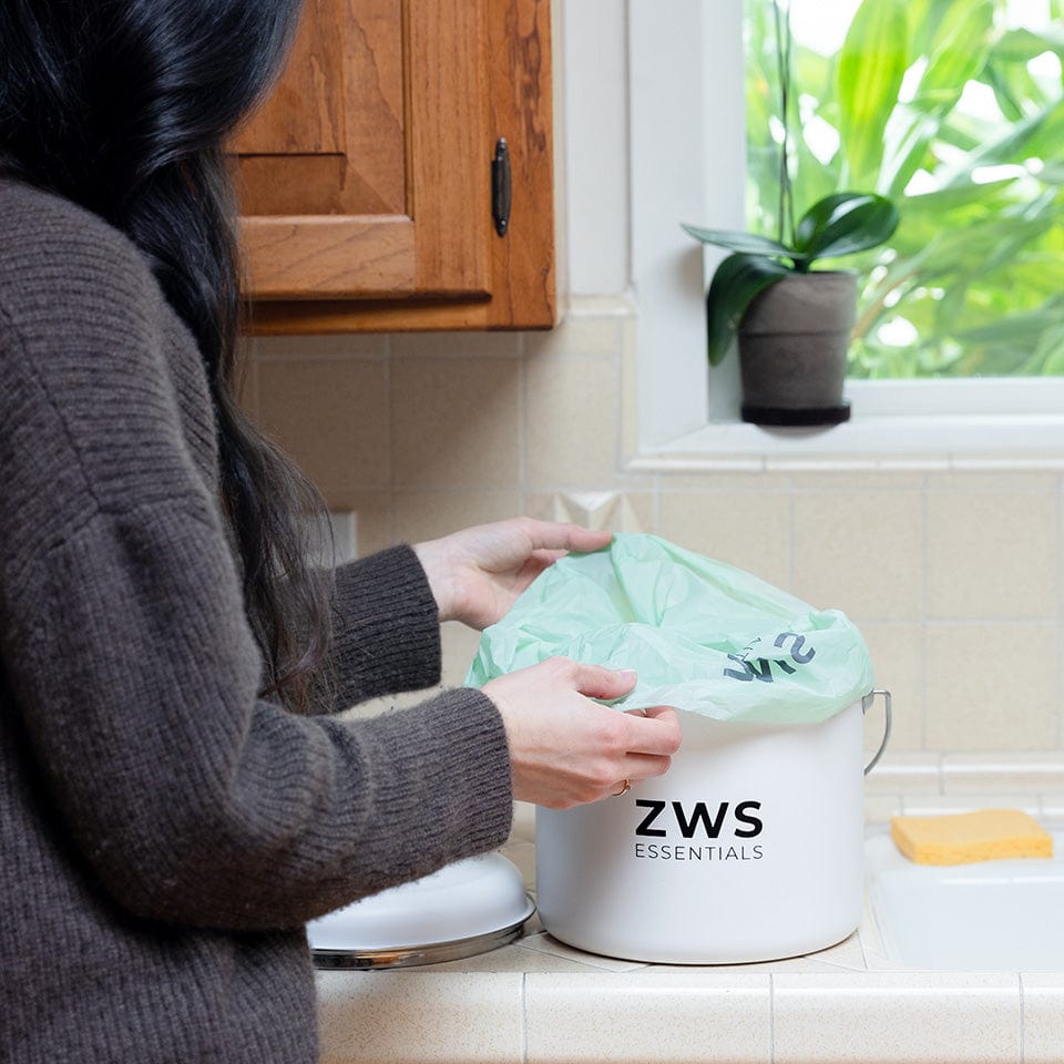 DEC2024_ZWS_ProductwithModels_CompostBin_cropped_960px.jpg__PID:9c6cd9c7-063b-4d7f-ad8f-8d980ec9265a