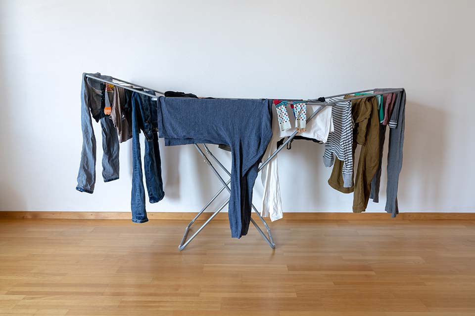 Clothes hanging on a foldable drying rack