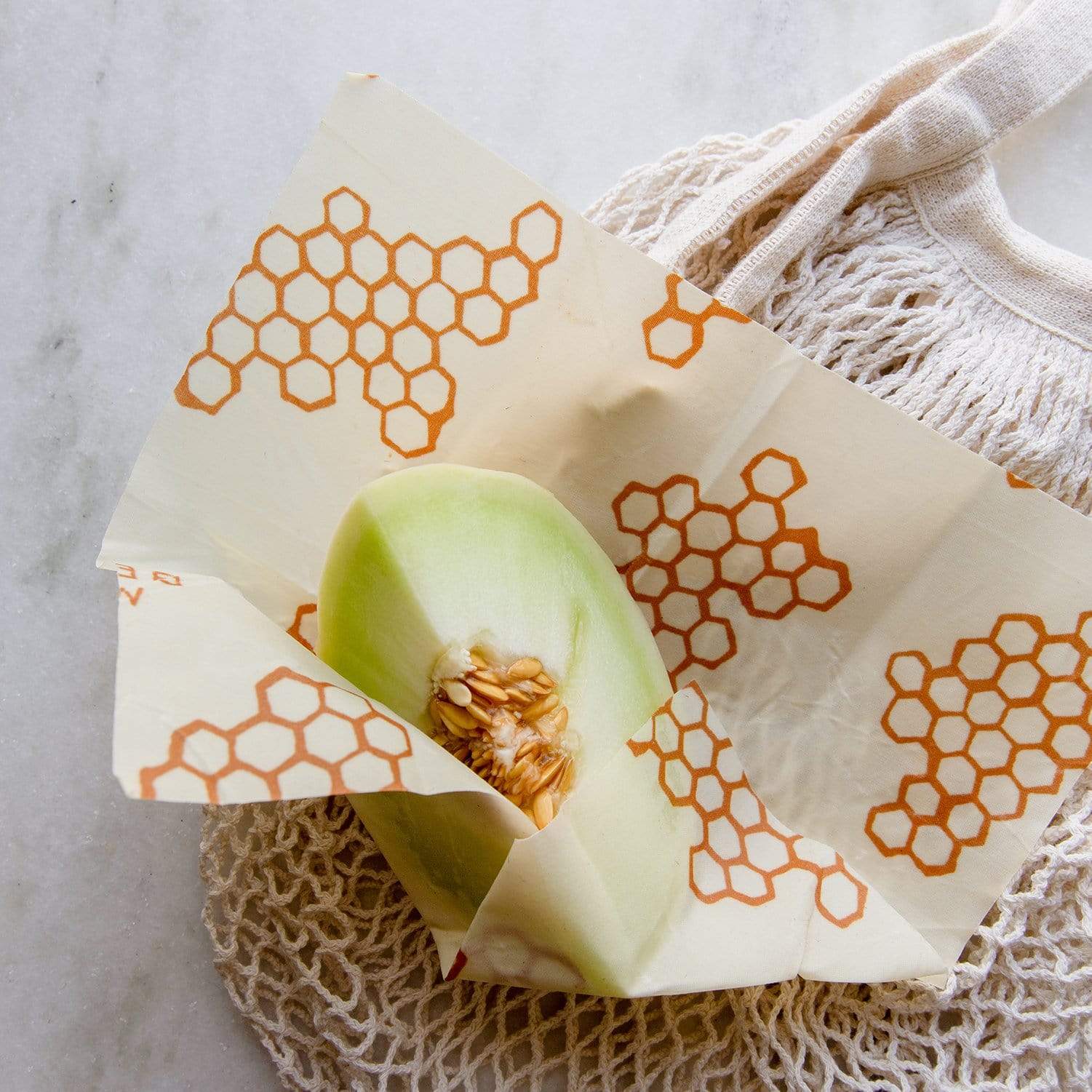 Beeswax wrap covering a quarter of a melon