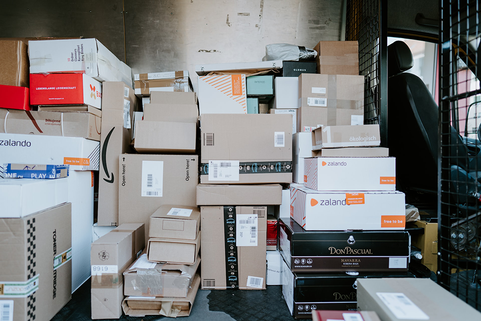 back of delivery truck filled with various boxes