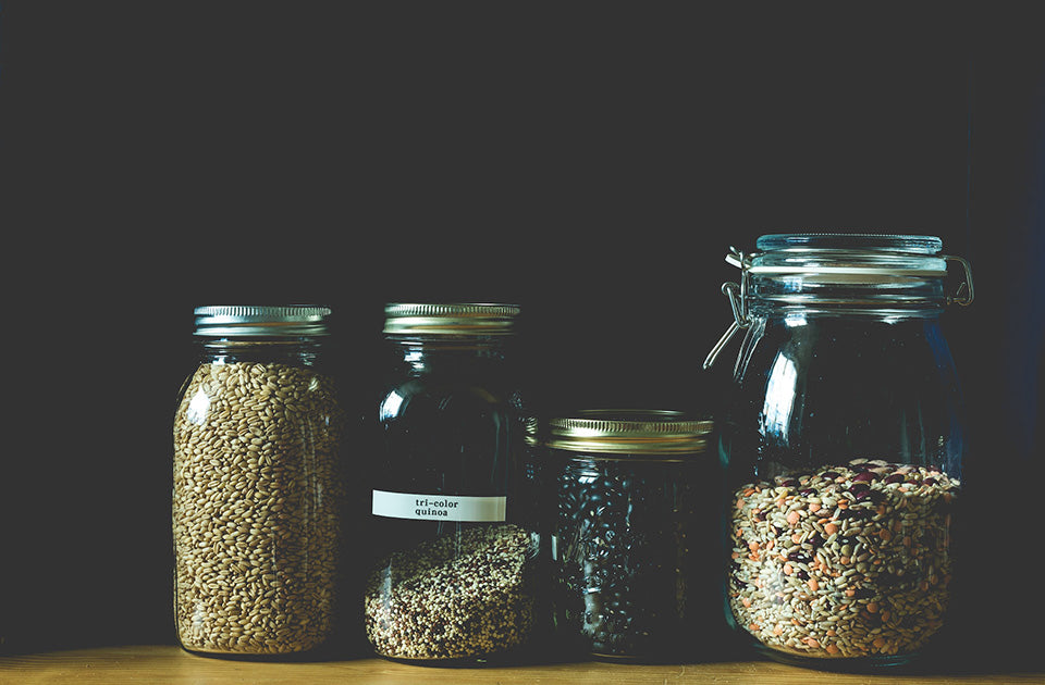 glass jars filled with beans and grain