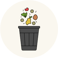 food scraps and waste falling into a trash can