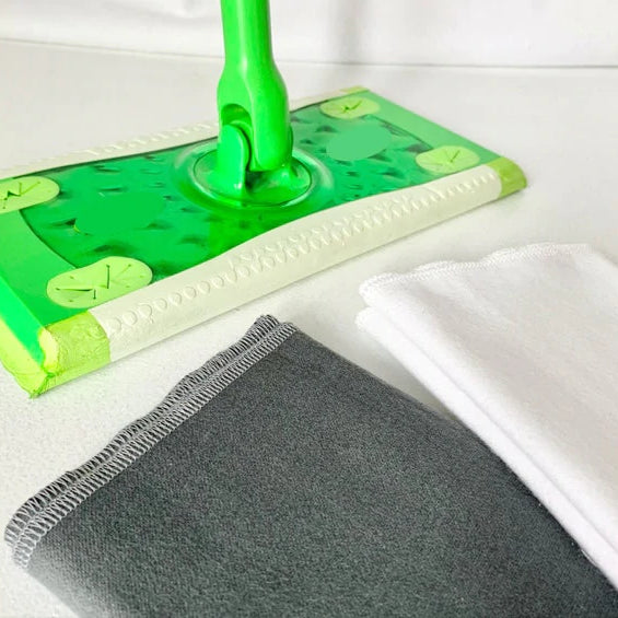 Reusable mop covers with swiffer in the back of the frame.