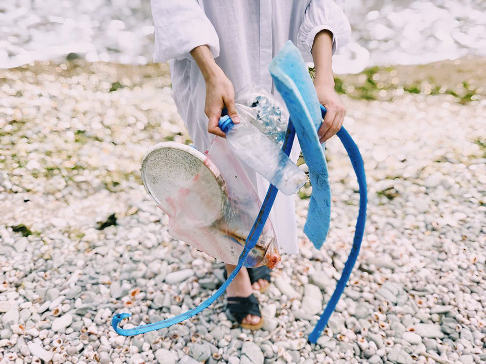 Person Holding Plastic Bottle