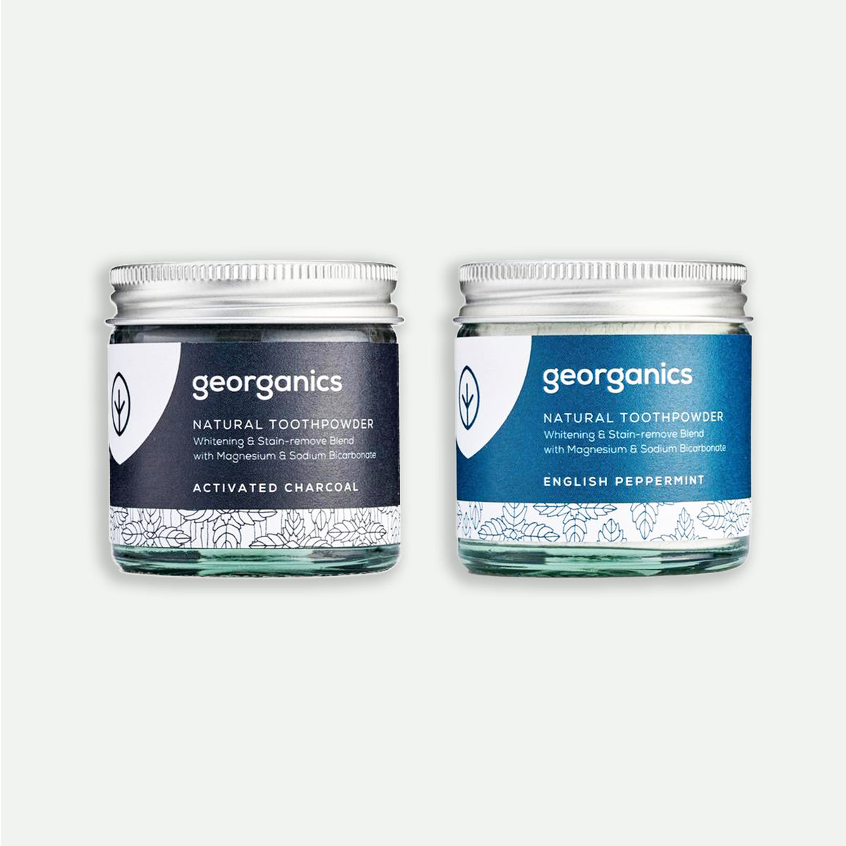 Two glass jars of georganics natural toothpowder in Activated Charcoal and English Peppermint flavors