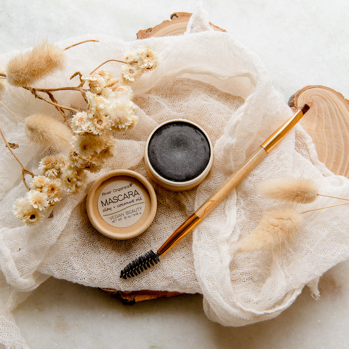 Vegan Mascara in compostable cardboard container with bamboo spoolie and eye shadow brush combo