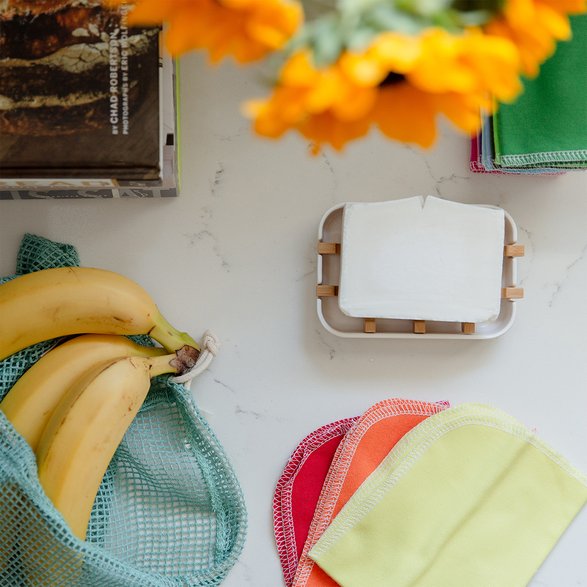 White Soap Bar sitting on white soap dish with wood planks