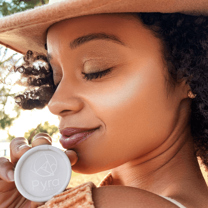 Three mineral brow powders in small tin containers. In colors light medium and dark