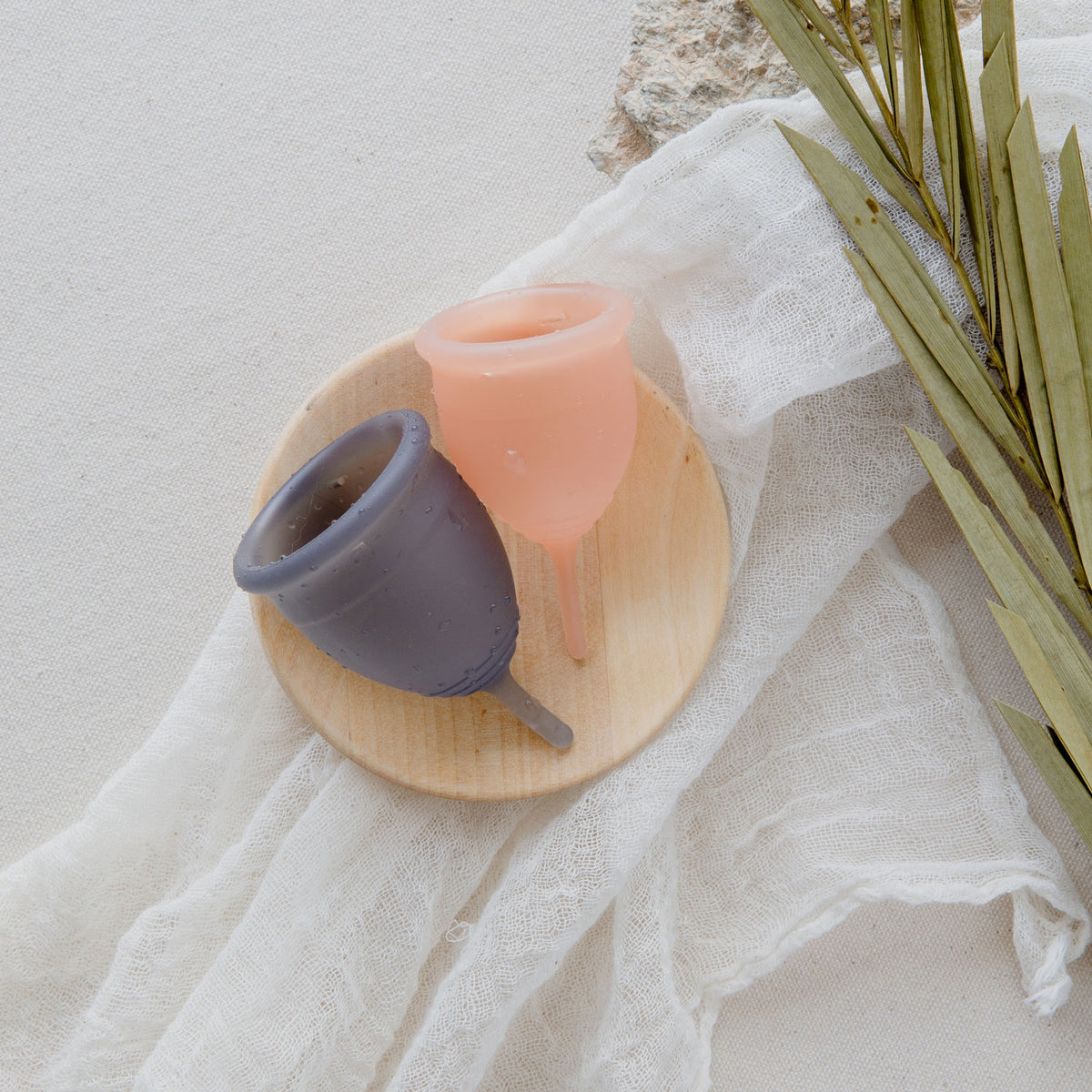 light pink and gray silicone menstrual cup