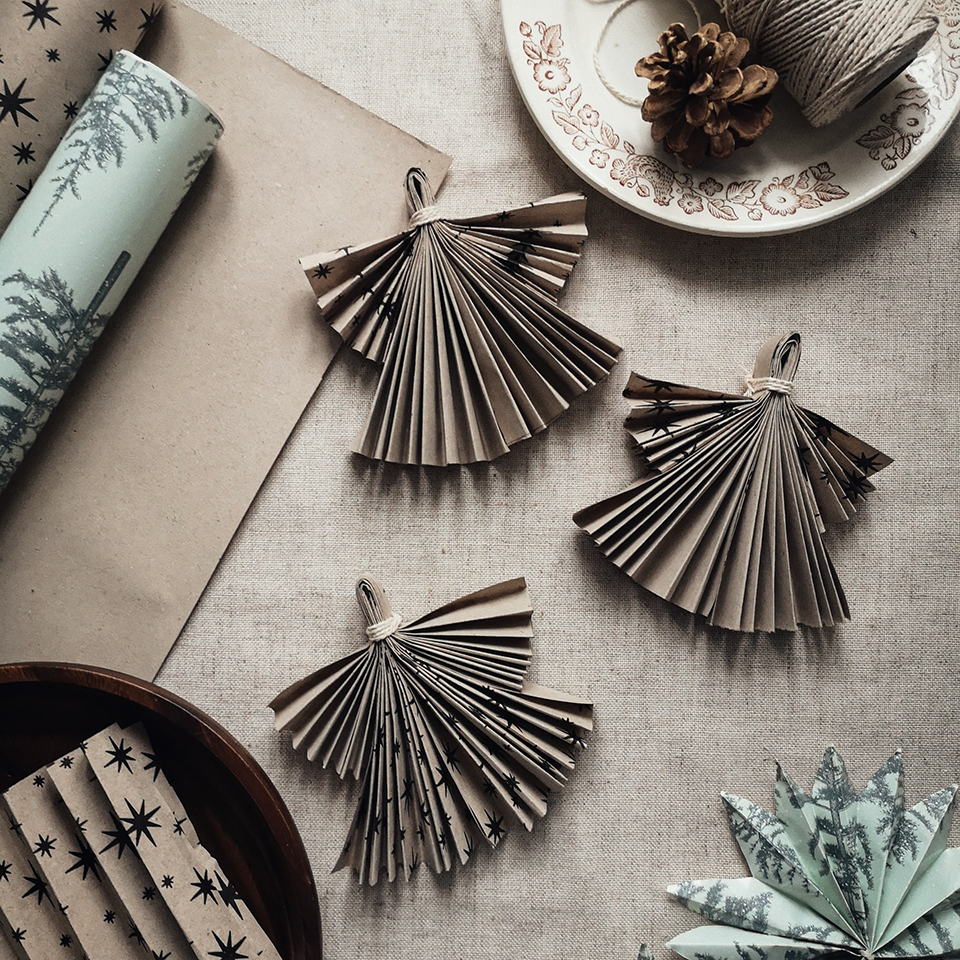 diy paper ornaments folded into angel shapes