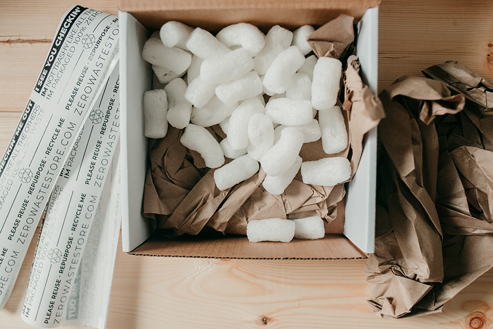 Water activated tape, recycled box, cornstarch packing peanuts, and recycled packing paper