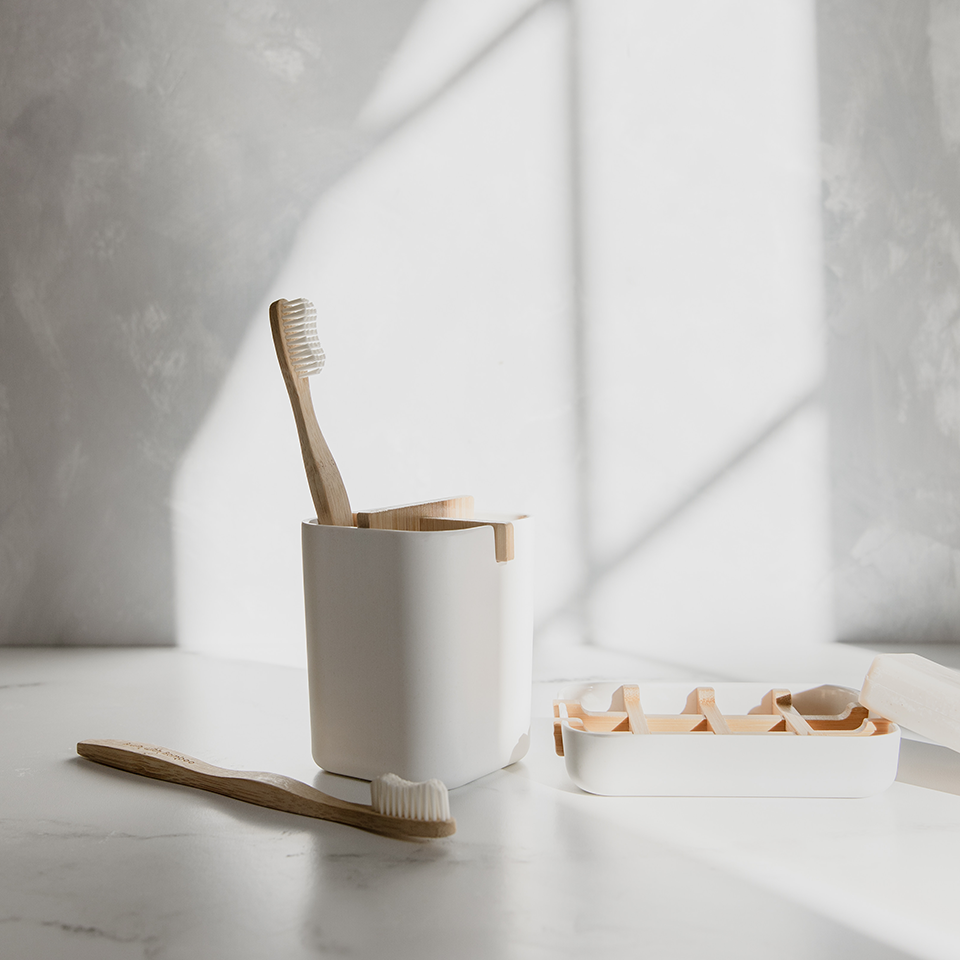 Bamboo toothbrushes in a holder