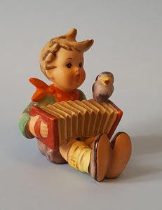 hummel boy with accordion and bird