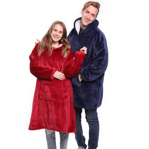 couple wearing blanket sweatshirt