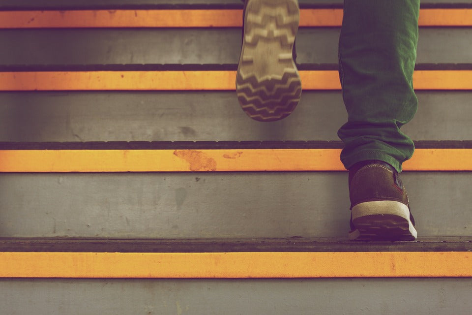 legs walking up stairs