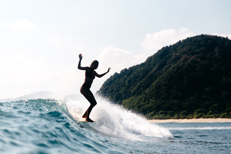 Ivy Thomas surfing mid-day