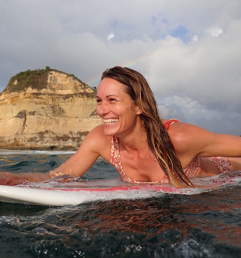 Female surfer smiling