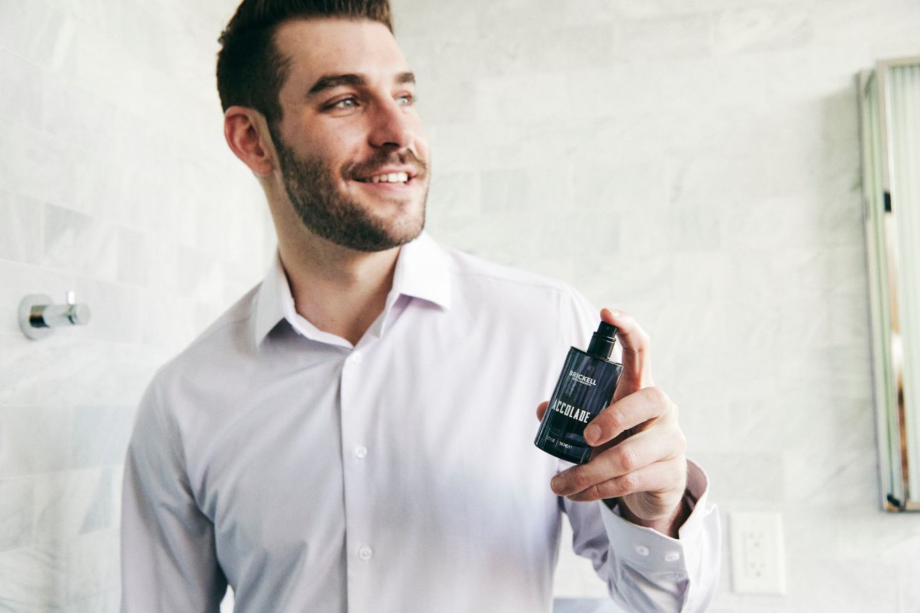 Man applying cologne