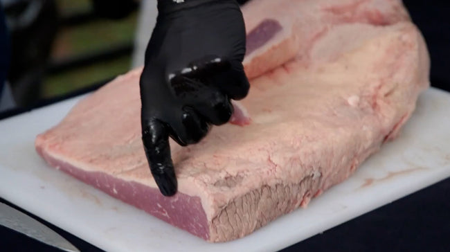 Showing the thickness of the brisket fat cap