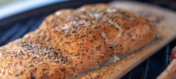 Salmon on a grilling plank on the grill
