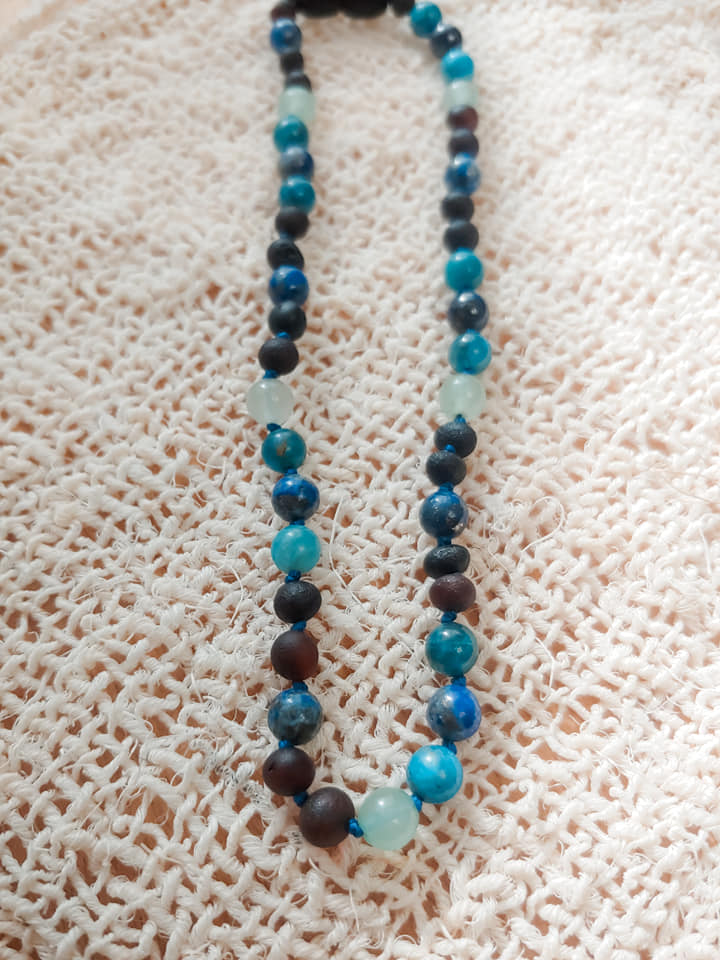 teething necklace with raw cherry amber, raw african turquoise, and ha –  UB2 | Urban Baby Bonnets