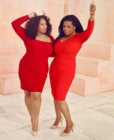 Oprah and Tricia Campbell in red dresses