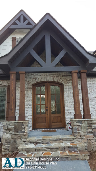 An interesting and welcoming entry is created with the use of medium range brick, and warm dark stained woods.