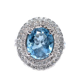 white gold blue topaz and diamond halo ring