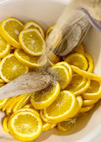 muddling lemons for fresh lemonade recipe